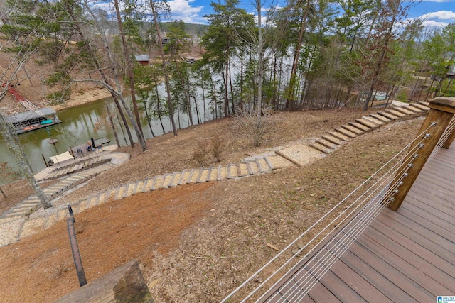 view of yard with a dock and a water view