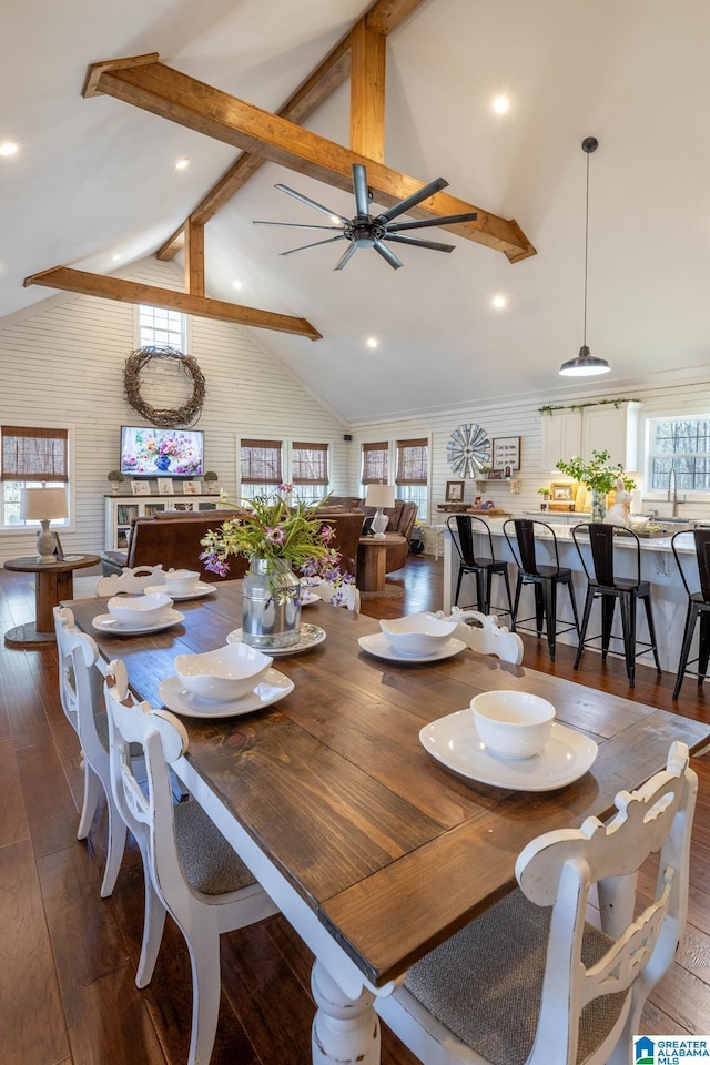 dining area with recessed lighting, beamed ceiling, high vaulted ceiling, and hardwood / wood-style flooring