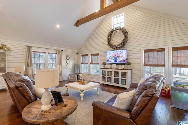 living area with hardwood / wood-style floors, beam ceiling, and high vaulted ceiling