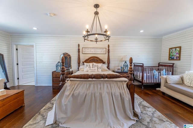 bedroom featuring recessed lighting, a chandelier, and dark wood finished floors