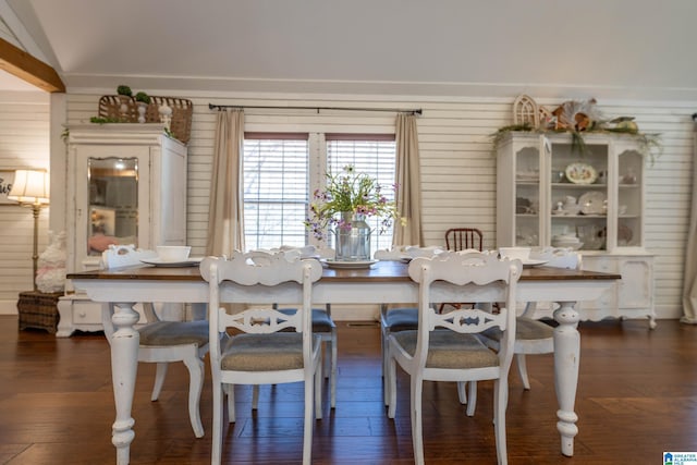 dining room featuring vaulted ceiling and wood finished floors