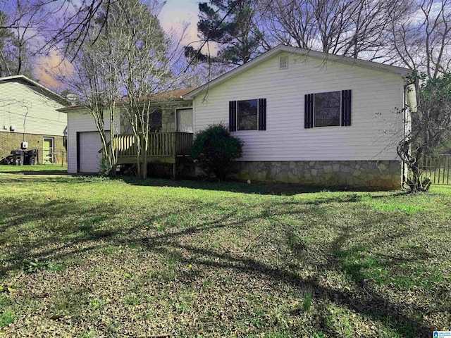 view of front of house with a front yard and a garage