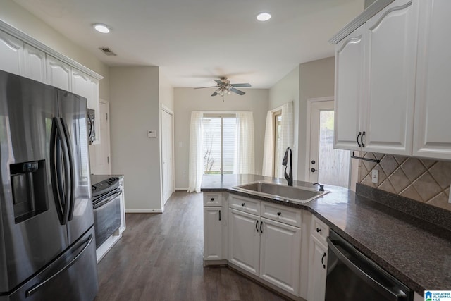 kitchen featuring stainless steel fridge with ice dispenser, a sink, dishwasher, range, and backsplash