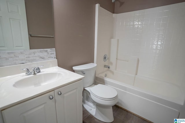 bathroom featuring shower / bath combination, toilet, vanity, and wood finished floors