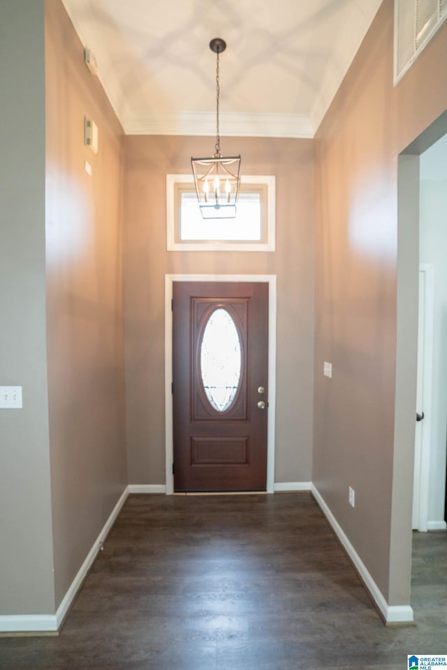 entrance foyer featuring dark wood finished floors, visible vents, and baseboards