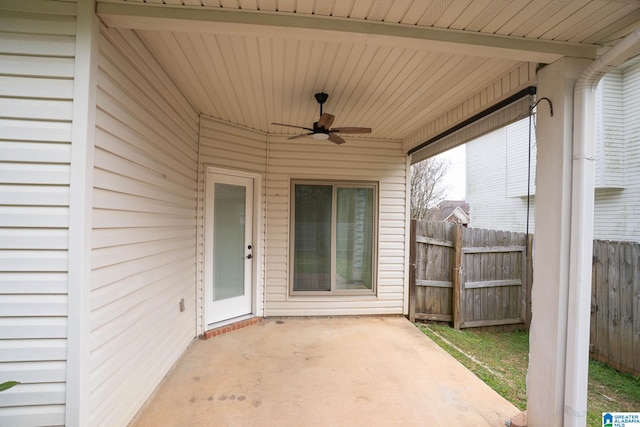 view of patio featuring a ceiling fan and fence