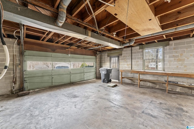 garage featuring concrete block wall