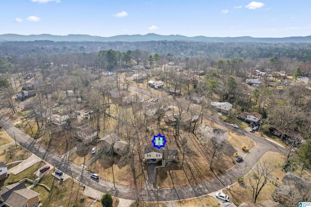 aerial view featuring a mountain view and a view of trees