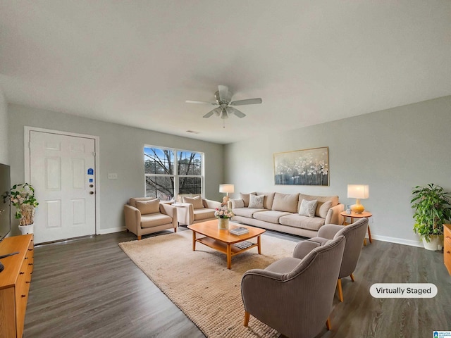 living room with baseboards, a ceiling fan, and dark wood-style flooring