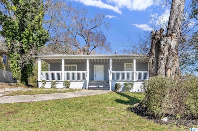 view of front of home with covered porch and a front yard