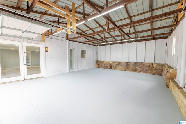 garage with french doors and metal wall