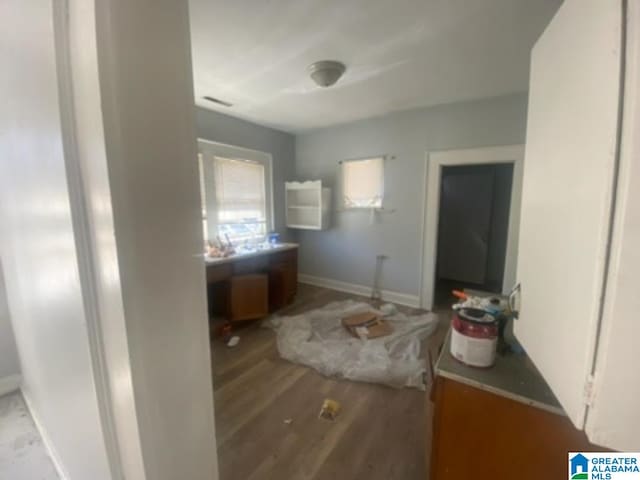 bathroom featuring baseboards and wood finished floors