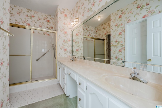 bathroom featuring tile patterned floors, a shower stall, wallpapered walls, and vanity