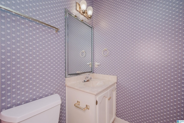 half bath with vanity and toilet