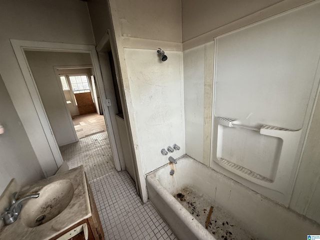 bathroom featuring vanity, shower / bathtub combination, and tile patterned flooring