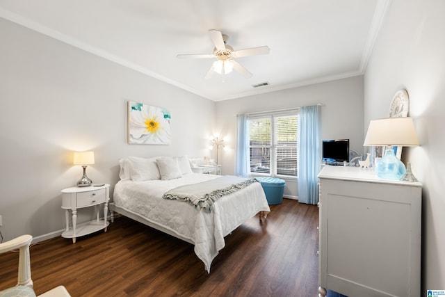 bedroom with visible vents, ceiling fan, baseboards, dark wood finished floors, and ornamental molding