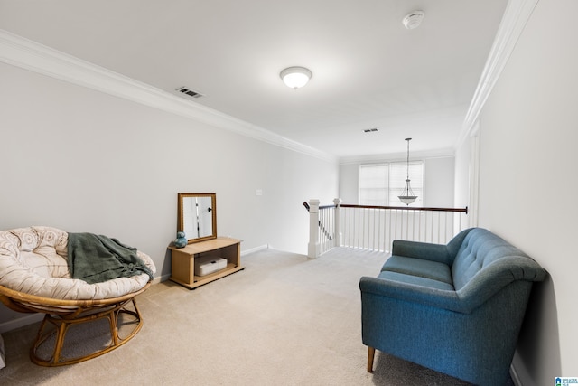 sitting room featuring visible vents, baseboards, ornamental molding, light carpet, and an upstairs landing