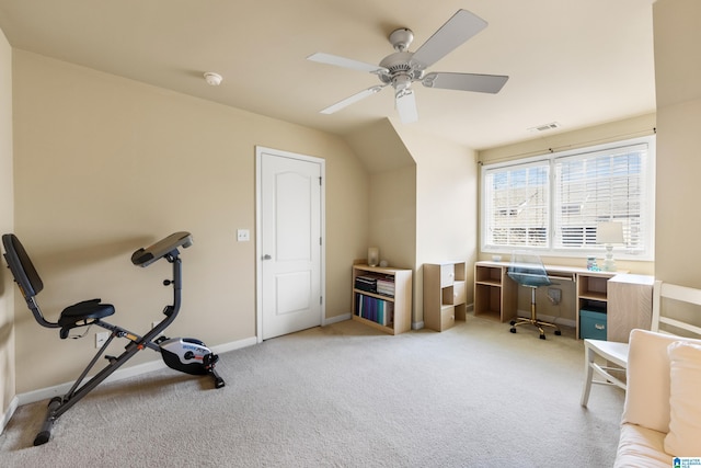 office area featuring baseboards, a ceiling fan, visible vents, and light carpet