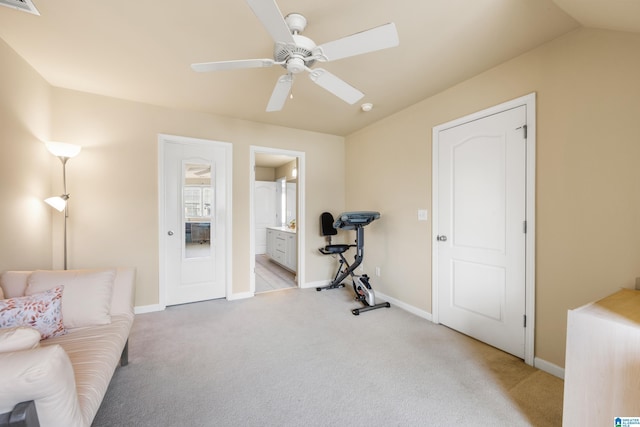 workout room with visible vents, baseboards, ceiling fan, vaulted ceiling, and light colored carpet