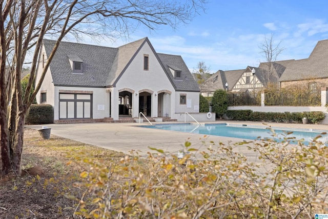 outdoor pool featuring a patio