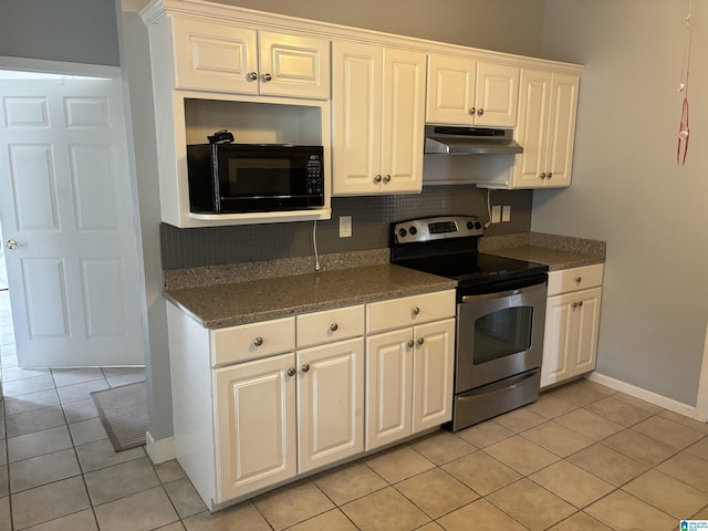 kitchen with light tile patterned floors, decorative backsplash, electric stove, under cabinet range hood, and black microwave