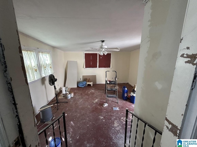 living area with a ceiling fan