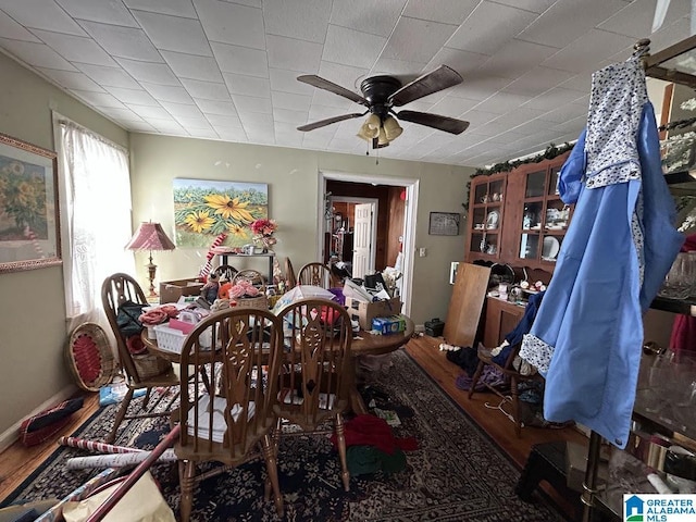 dining room featuring ceiling fan and wood finished floors