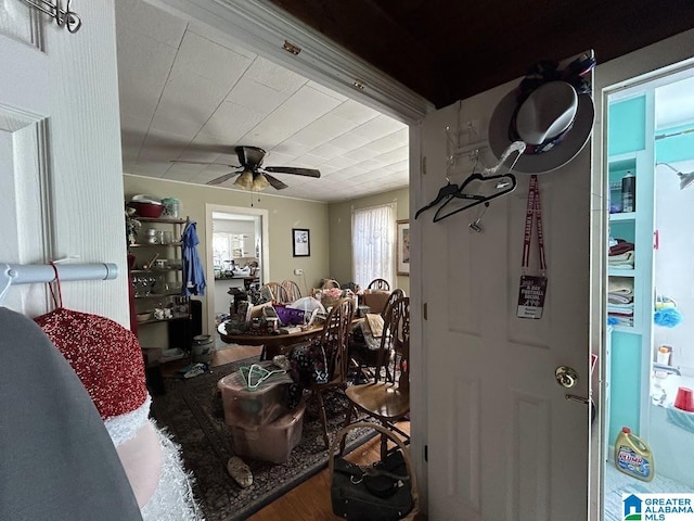 interior space featuring wood finished floors and ceiling fan