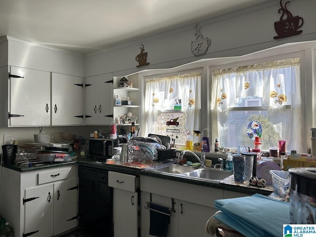 kitchen featuring dark countertops, a sink, white cabinets, black appliances, and open shelves