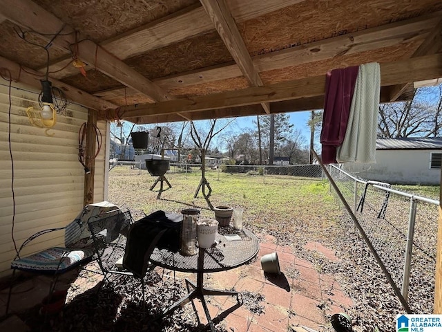 view of patio featuring fence