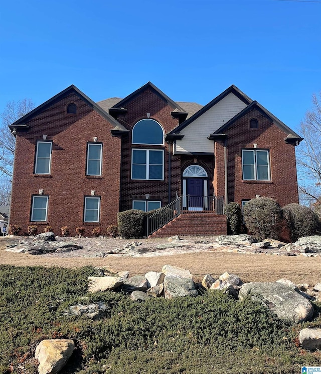 view of front of property featuring brick siding