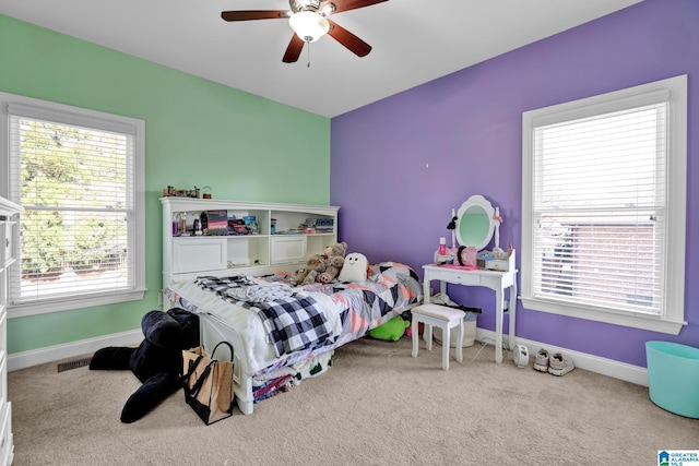 bedroom featuring visible vents, baseboards, carpet floors, and ceiling fan