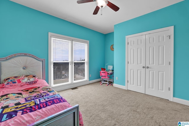 bedroom with visible vents, a closet, carpet floors, baseboards, and ceiling fan