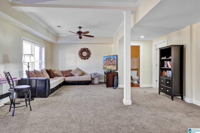 living area featuring carpet flooring, a ceiling fan, crown molding, and visible vents