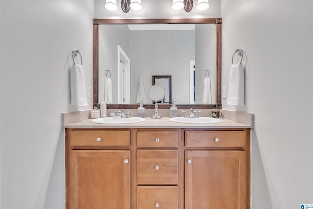 full bath with double vanity and a sink