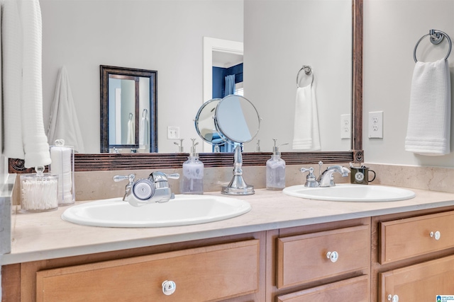 bathroom with double vanity and a sink