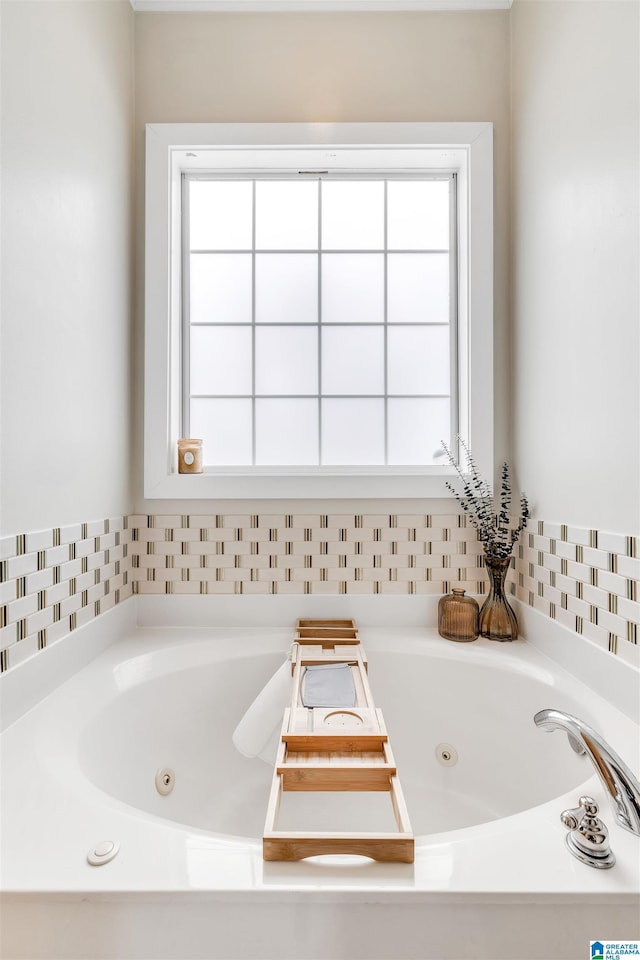 full bathroom with a whirlpool tub