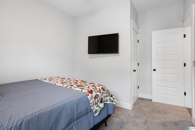 bedroom with baseboards and carpet floors