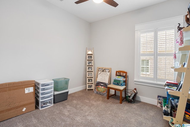 recreation room featuring baseboards, plenty of natural light, carpet, and ceiling fan