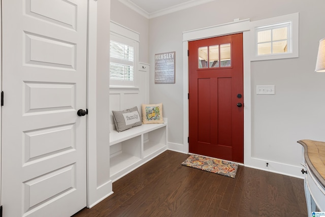 entryway with dark wood-type flooring, baseboards, and ornamental molding