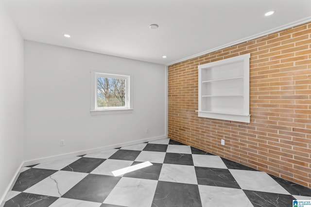 unfurnished room featuring tile patterned floors, built in shelves, recessed lighting, and baseboards