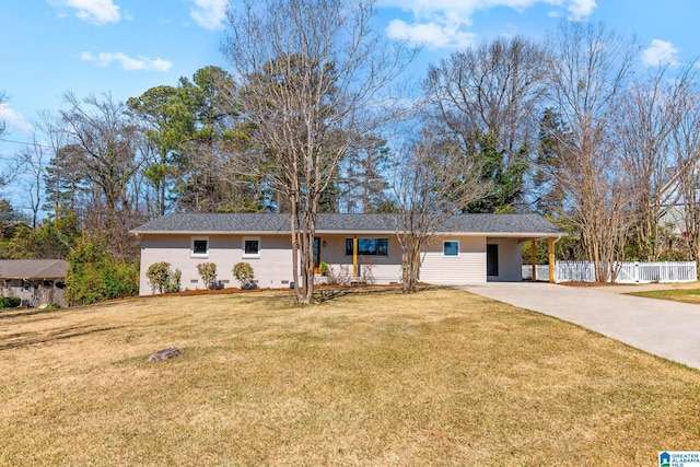 ranch-style home featuring crawl space, concrete driveway, a front lawn, and fence