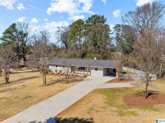 single story home with an attached carport, driveway, and a front lawn