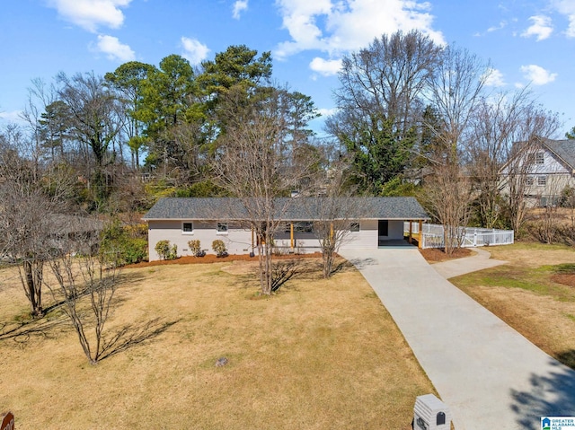 ranch-style home with a front lawn