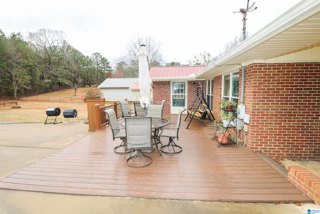 wooden deck with outdoor dining space