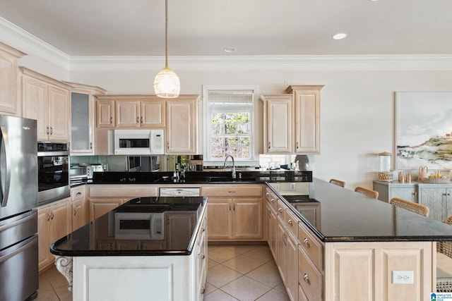 kitchen with light brown cabinetry, appliances with stainless steel finishes, crown molding, and a sink