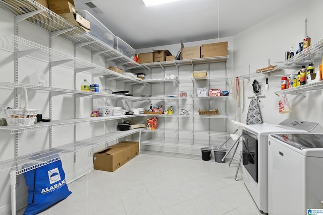 storage room featuring washing machine and dryer