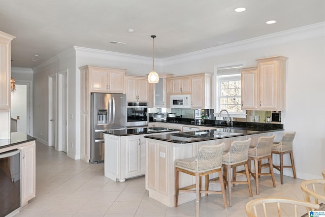 kitchen featuring beverage cooler, ornamental molding, appliances with stainless steel finishes, a peninsula, and a sink