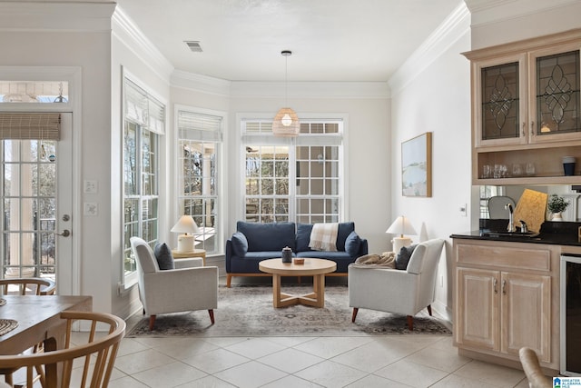 living room with light tile patterned flooring, visible vents, wine cooler, and ornamental molding