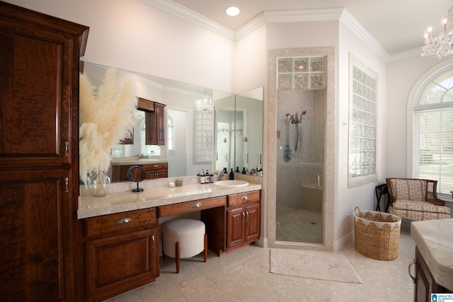 bathroom featuring a chandelier, a stall shower, vanity, and crown molding